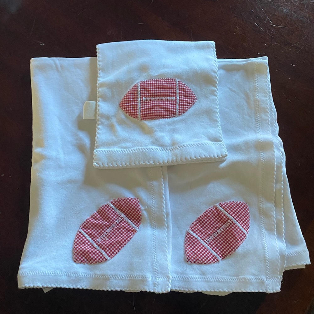 Two blankets and a burp cloth